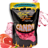 Bag of Yum Yum Candy Sours in Grapefruit flavor, displayed with an assortment of fruits and the candy pieces visible.